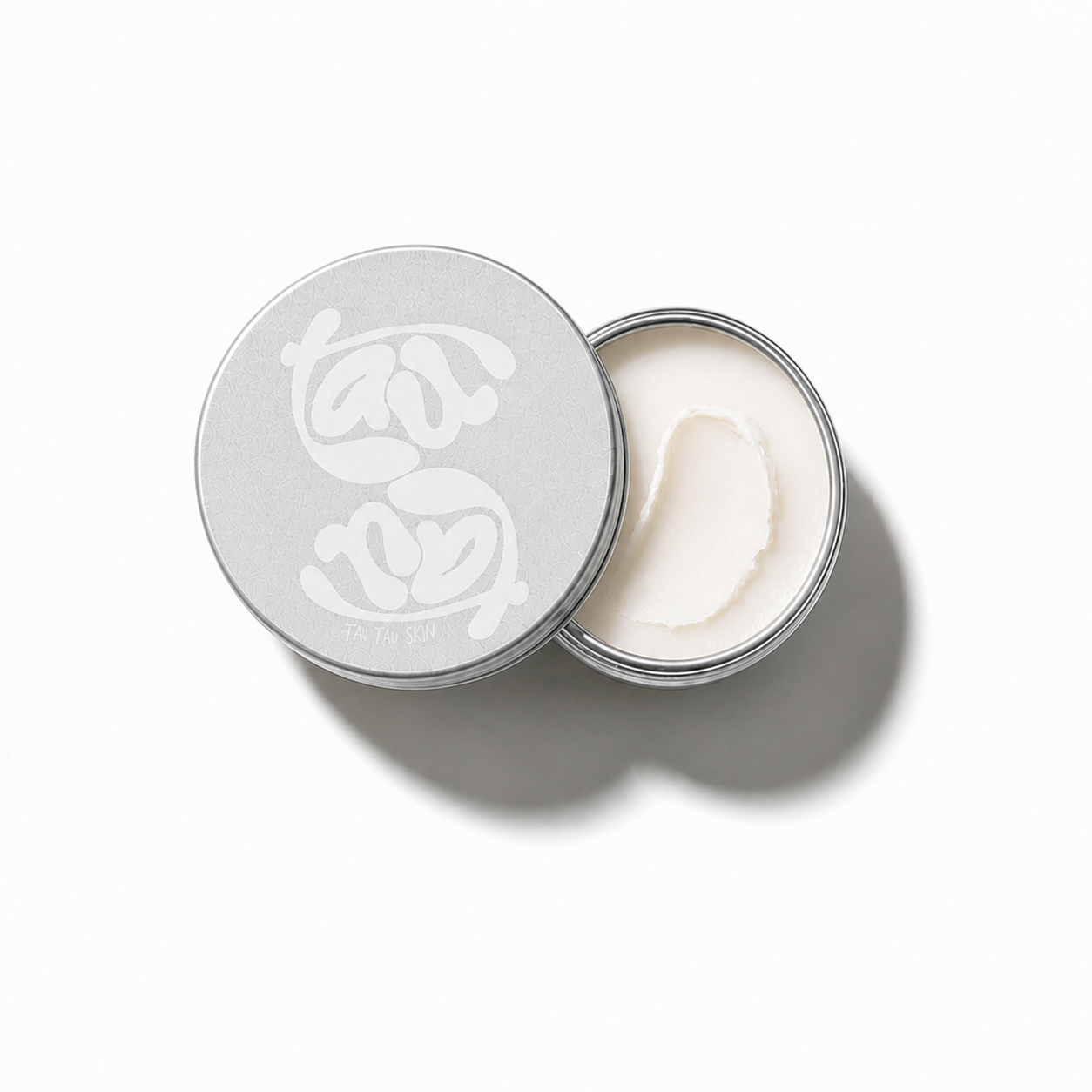 Tau Tau Skin Nourishing Lip Balm in branded metal tin — clean tallow and beeswax balm for chapped lips